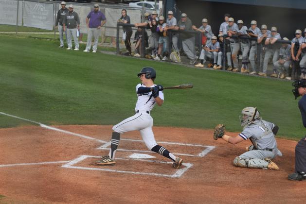 J. Ben Haynes rips a double down the third base line to drive in the Warriors' lone run in an 8-1 loss to Cherokee Bluff last Friday in Cleveland. (Photos/Mark Turner)