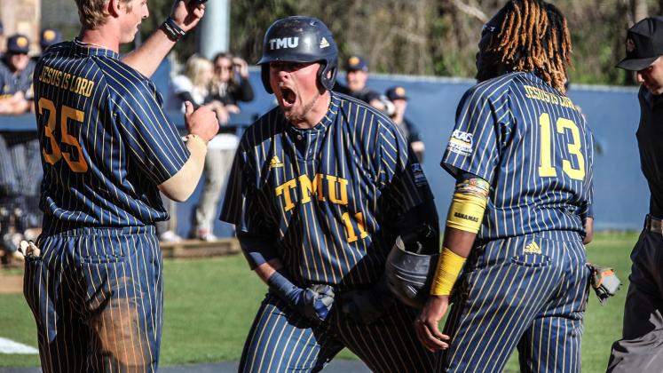Mason Gaines, left, shown celebrating with Devyn Munroe, had a home run in the Bears' 15-5 win in the opening game of the series.