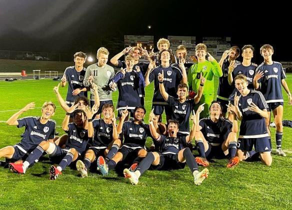 The Warriors celebrate following the 2-1 win over West Hall last week at Warrior Stadium. The win clinched the Region 7-AAA title and gives the Warriors the No. 1 seed heading into the Class AAA state tournament, which begins April 21.