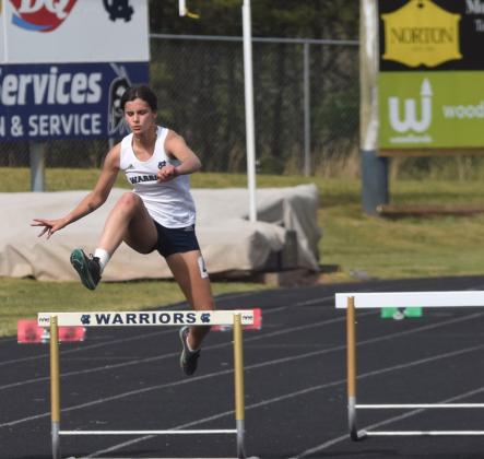 Lily Gearing won the girl's 300-meter hurdles title, finishing second in the 400-meter race, and was third in the long jump.