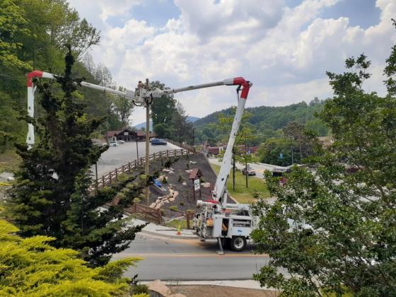 Workers setting the pole to replace the broken one. (Submitted photo)