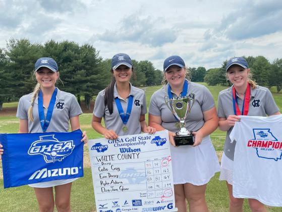 WCHS golfers, from left, Catie Craig, Eliza Jane Glover, Erin Dorsey, and Rylee Adams show off the Class AAA championship trophy Tuesday after winning the school's first ever spring sports team title. (Photo/WCHS Athletics)