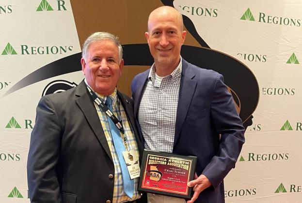WCHS athletic director Craig Turner, right, is shown with Georgia Athletic Directors Association's executive director Joe Sanflippo during the GADA awards banquet last Saturday in Atlanta. (Photo/GADA)