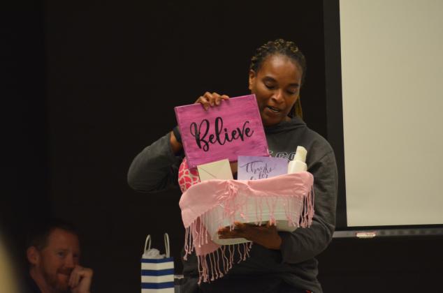 WCMS teacher and KISS Club adviser Debbie Carter-Dye displays some of the goodies in gift baskets prepared for teachers. (Photo/Wayne Hardy)