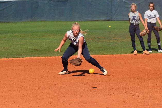 Katelyn Boman fields a ground ball during the Lady Warriors' practice session Wednesday morning at the WCHS softball complex. (Photo/Mark Turner)