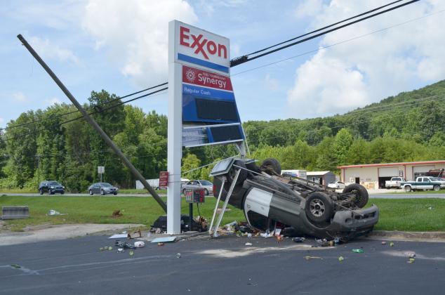 One person has been charged after hitting an Exxon Gas Station sign on Wednesday, July 14. (Photo/Stephanie Hill)
