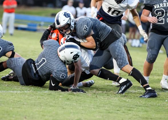 Zion McMullen, left, and Bryson Cronic, right, tackle Habersham Central's Zeke Whittington during the game last Friday night in Cleveland. (Photo/Staci Sulhoff)