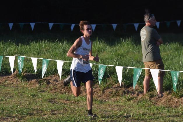Lance Kelley was one of the top runners for the Warrior cross country teams during the Warpath Invitational  in Canton. (Photos/Mark  Turner)