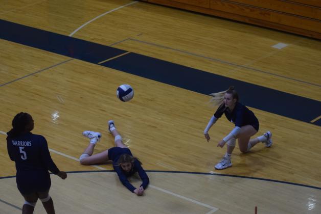 Peyton Hayse makes a diving save to keep the ball alive during the win over Gilmer County.