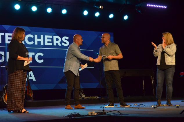 From left, Fellowship of Christian Athletes area representative John Luna shakes hands with The Bridge Lead Pastor Patrick Ballington. (Photo/Wayne Hardy)
