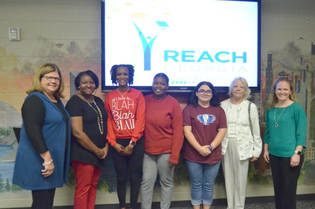 Shown from left at the Oct. 25 REACH Georgia scholarship signing are White County School Superintendent Dr. Laurie Burkett, White County Middle School Principal Nara Allen, Brittany Wilmont, Jazmeene Wilmont, Serenaty Brown, Ella McCusker and White County High School Principal Mary Anne Collier. (Photo/Wayne Hardy)