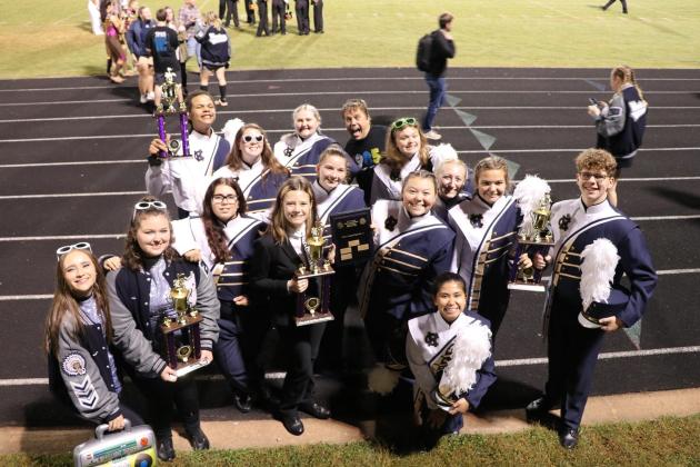 White County High School marching band members pose with some of the hardware won during their recent band competition. (Submitted photo)