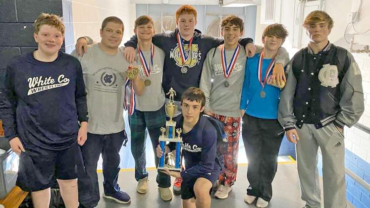 Members of the WCHS wrestling team show off some of the hardware the team won during the Granite City Scramble last weekend in Elberton. Shown are, front, Bryson Ravan; standing from left, Tyler Long, WCHS head coach Patrick Lowendick, Caden Autry, Gunner Young, Mason Autry, Aiden Pickett, and Ashton Pickett. (Photo/WCHS Wrestling)