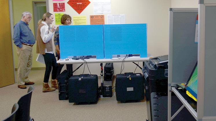 White County Election Supervisor Akyn Bailey, middle, previews the voter training precinct to county Board of Elections &amp; Registration board members Mike Mays and Louise Nix. (Photo/Wayne Hardy)