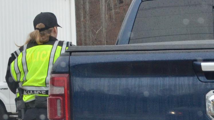 Cleveland Police Department officer Sarah Emery approaches a truck during traffic patrols Tuesday.