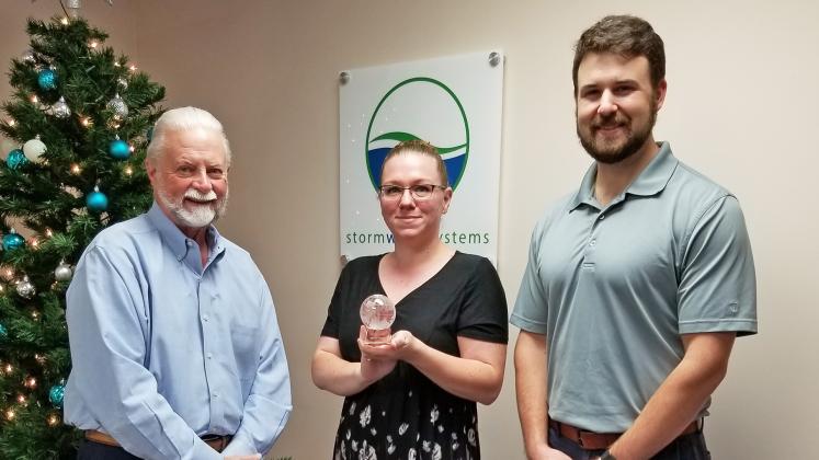 Shown from left are Storm Water Systems President Gary Hopkins, General Manager Liz Menius and Dustin Dunagan, business development.