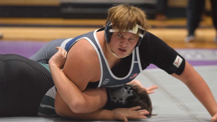 JD Trowell dominated a pair of 285-pound divison matches during the 7-AAA Area Duals. Trowell posted a pair of first period pins itn the Warriors' win on the way to the program's first area duals championship.