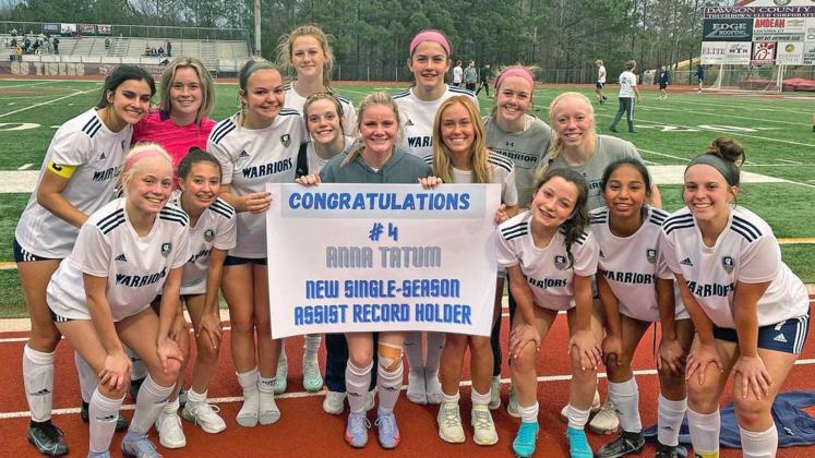 Anna Tatum, middle, celebrates with her teammates after setting the single season assist record Tuesady against Dawson County. Tatum had a pair of assists in the 10-0 win, gving her 14 on the season.(Photo/WCHS Soccer)