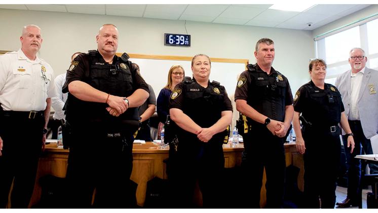 From left, Cleveland Police Chief Jeff Shoemaker, CPD Officers Rayner, Riebold, Addis, and Sims sporting bullet proof vests and President of North Georgia Mountains Lodge #112 Micheal Palmer at the city council meeting held on May 9. (Ashley Blair/WCN)