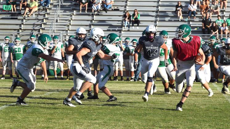 Warrior defenders Nate Bray, right, and Devin Norton, No. 44, close in on a Franklin County ball carrier during the spring game in Carnesville.