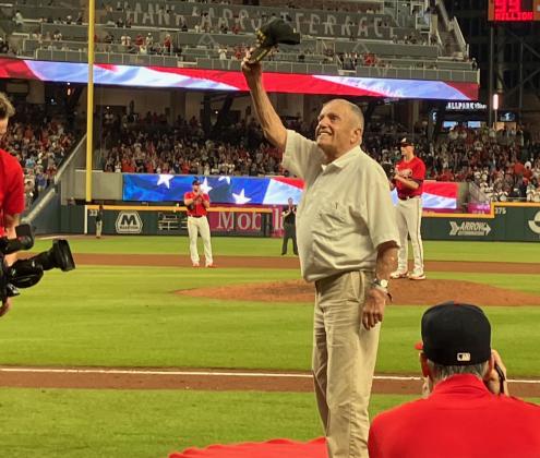 Skylake resident Andy Negra waves from the field between the 4th and 5th innings of the Braves game against Houston Astros in Atlanta.