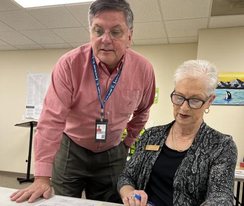 White County Elections Supervisor Jody Davis (left) and Chief Registrar Carol Smith review paperwork as early voting got underway this week.