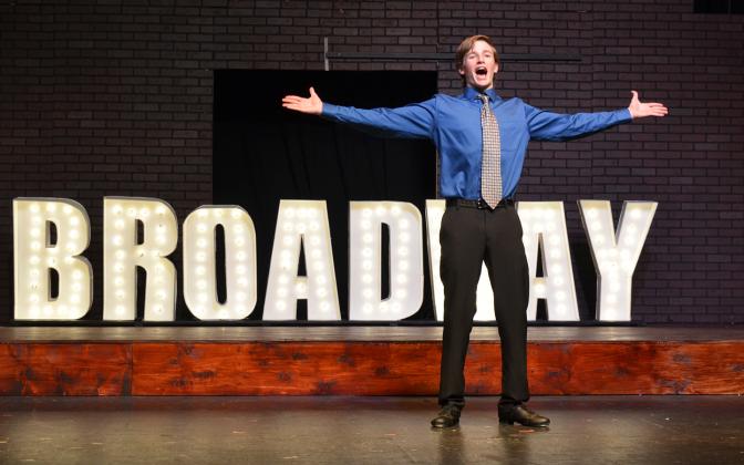Sebastian Wiley belts out the words “gotta dance” at the opening of  the “Broadway Ballet” scene during a rehearsal for “Singin’ in the Rain.” (Photo/Samantha Sinclair)