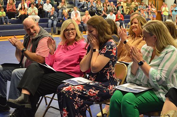 White County School System Teacher of the Year Holly Witcher places her head in her hands as fellow school honorees Brad Abernathy, Tina Vandiver and Meredith McConnell congratulate her. (Photos/Samantha Sinclair)