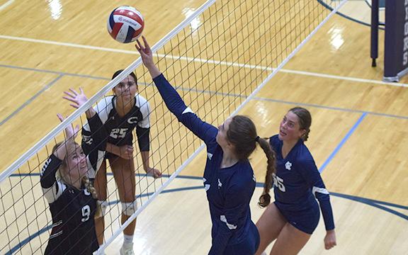White County middle hitter Emma Kerley makes a play on a ball at the net during a match against Chestatee Tuesday at the WCHS gym. (Photo/Mark Turner)