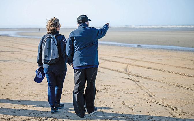 “Oh wow — the beach is so calm now. It wasn’t like this when we landed,” Virginie Durr recalls Andy Negra telling her as they looked out on Omaha Beach in Normandy. (Photo/submitted)