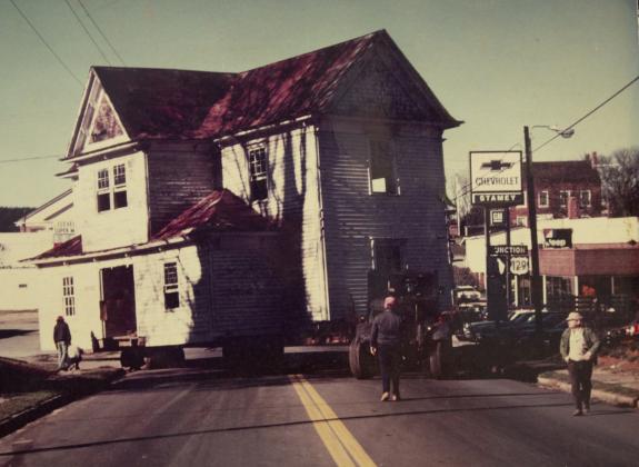 The historic home of Rush Mauney is transported to its new land through downtown Cleveland in 1978. (Photo/submitted)