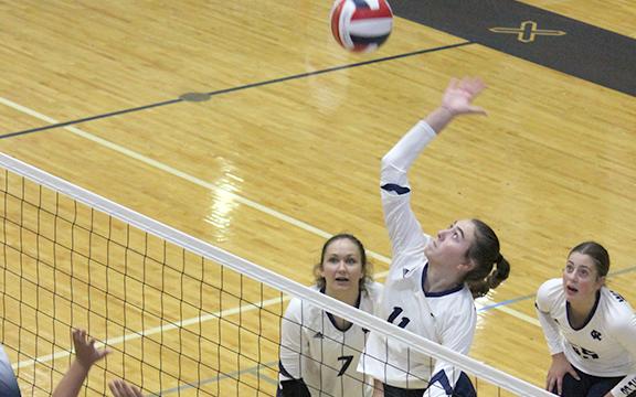 Emma Kerley goes up for a shot during the opening set of the Lady Warriors' win over West Hall. (Phot0/Mark Turner)