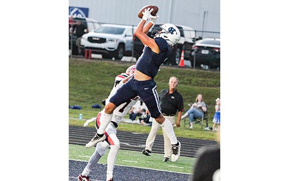 John Phillips leaps to grab a pass in the back of the end zone for a touchdown during the first quarter of the Homecoming game against Stephens County. (Photo/Staci Sulhoff)