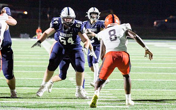 Tyler Seymour blocks for Tripp Nix during a game earlier this season.  (Photo/Staci Sulhoff)