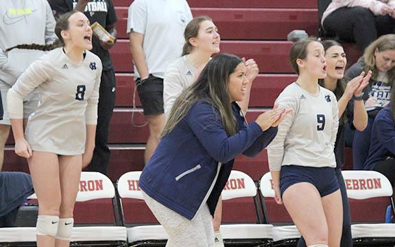 White County's Kate Blair, left, head coach Yarixa Oakes, Emma Kerley and Jalyn Allison celebrate during the Class AAA state tournament match at Hebron Christian Saturday in Lilburn. (Photo/Mark Turner)