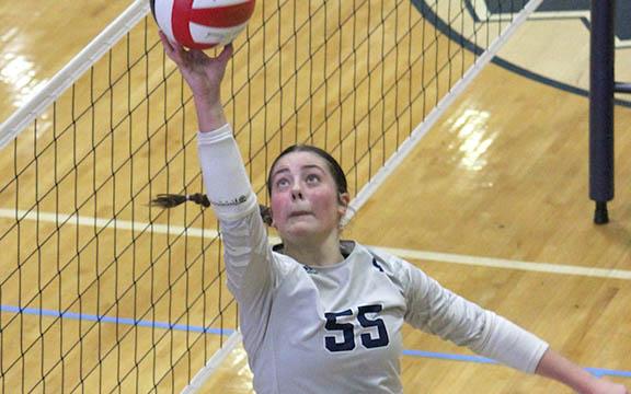 Linsey Burke, the 7-AAA Player of the Year, makes a play on a ball at the net during Tuesday's tournament win.  (Photo/Mark Turner)