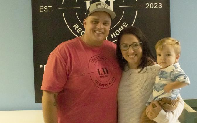 Cody and Jessica Montgomery, with their son Jaxson, help people at Levi’s House in Cleveland. (Photo/Noah Johnson)