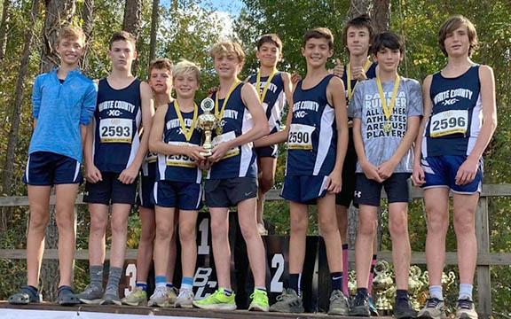 WCMS runners, front left, Weaver Bartlett, Wes Jones, Jax Adams, Reid Murphey, Aiden Cline, Ayden Mendez, Cam Biddy, Aden Hill, Weston Waller, and Briggs Murray show off the runner-up trophy at the state last weekend in Cochran. (Photo/WCMS Athleitcs)