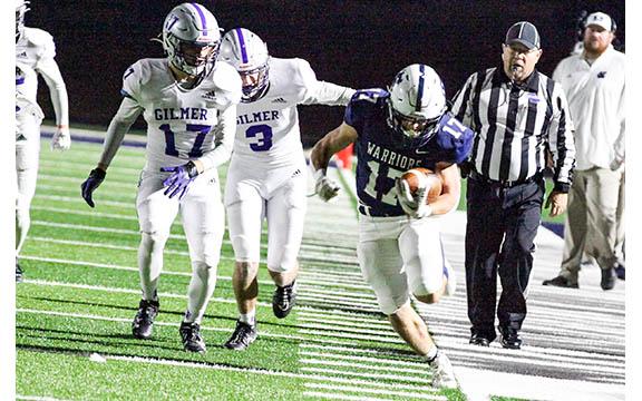 WCHS running back Ryan Fowler tiptoes down the sideline for a long run during the Warriors' 35-28 win over Gilmer in the regular season finale last Friday at Warrior Stadium. (Photo/Staci Sulhoff )