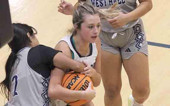 Emma Lightsey, right, battles West Hall's Allie Villeda for the ball during the region game Tuesday in Cleveland.  (Photo/Eli Shoemake)