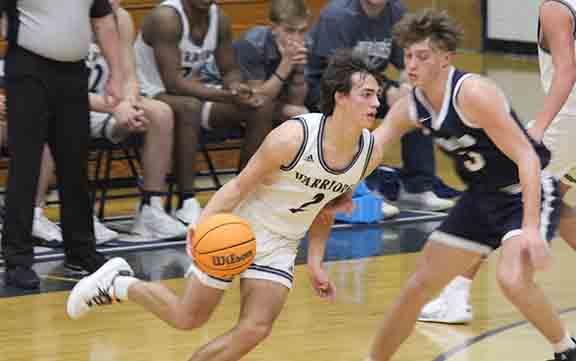 White County's Tripp Nix drives past West Hall's Landen Bennett during the second half of the region game in Cleveland. (Photo/Eli Shoemake)