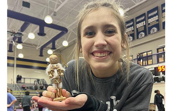 Ollie Weiland shows off the Nutcracker trophy after winning the 102.2-109.8 pound title in the girl's tournament. (Photo/WCHS Wrestling)