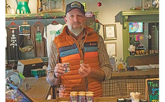 Owner and operator of Alpine Dispensary, Josh Garrison shows products in his express location in downtown Helen. (Photo/Noah Johnson)