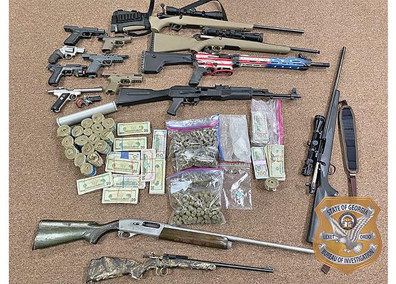 Guns, drugs and money found in the home of Michael Thompson of Cleveland. (Photo/submitted)