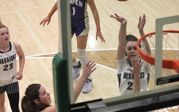 Kylie Watkins, shown putting up a shot during the first half of the region tournament game, scored in the final seconds of the game to give the Lady Warriors' a 45-43 win over Lmpkin County in the opening game of the Region 7-AAA tournament Tuesday in Jasper. The win gives the team a spot in the region semifinals along with an automatic berth in the state tournament. (Photo/Mark Turner)