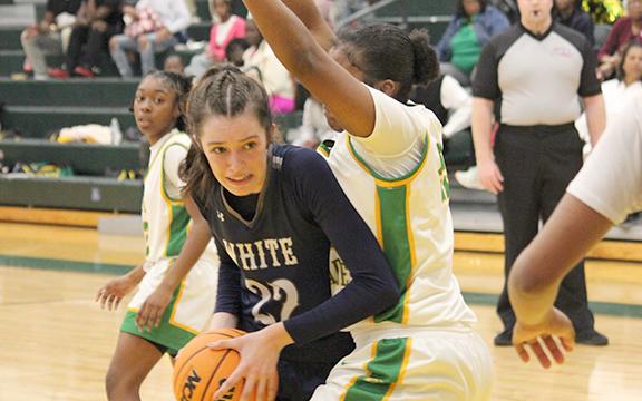 Kylie Watkins works for a shot in the low  post during the final quarter of the Elite Eight game in Monroe.  (Photo/Mark Turner)
