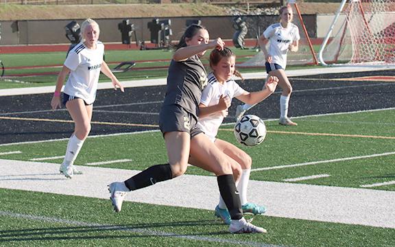 Lilly Gann, right, is one of several starters back from the Lady Warriors' Elite Eight team last spring. (Photo/Mark Turner)
