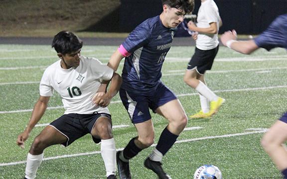 Preskitt Castleberry, right, scored the game-winning goal late in the second overtime period in the Warrios' 1-0 win over Pickens.  (Photo/Mark Turner)