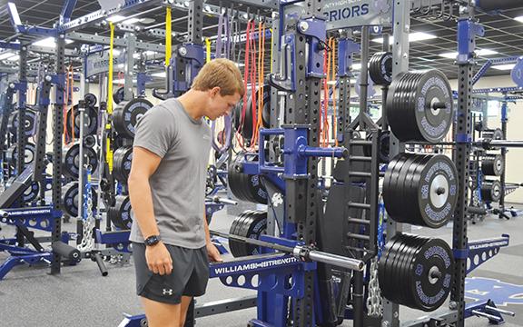WCHS senior Dade Anderson checks out the equipment in the new weight room  during open house Tuesday afternoon at the high school. (Photo/Samantha Sinclair)