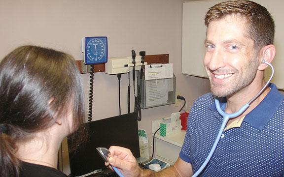 Dr. James Murphey, volunteer medical director of Community Helping Hands Clinic, cheerfully offers no-cost care to qualified uninsured White County residents at the free clinic on Cleveland’s Courthouse Square. (Photo/submitted)